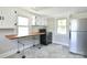 Galley-style kitchen with black appliances, butcher block countertop and bright lighting at 2306 W C St, Kannapolis, NC 28081