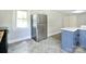 This kitchen features a new stainless steel refrigerator and an eat-in area at 2306 W C St, Kannapolis, NC 28081