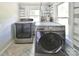 Laundry room features new, stainless steel front-loading washer and dryer at 2306 W C St, Kannapolis, NC 28081