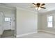 Bright living area with neutral walls and ceiling fan at 2306 W C St, Kannapolis, NC 28081