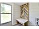 Mud room featuring shiplap accent wall, built-in bench and a coat rack at 2306 W C St, Kannapolis, NC 28081