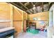 Unfinished interior of storage room with exposed beams, shelving, and various supplies at 2306 W C St, Kannapolis, NC 28081