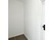 Walk-in closet with hardwood flooring and a white door with a black door knob at 2306 W C St, Kannapolis, NC 28081