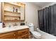 Bathroom featuring a vanity, mirror with lighting, toilet, and shower-tub combo at 2718 Ridgewood Ln, Rock Hill, SC 29730