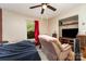 Bedroom featuring a ceiling fan, window with red curtain, and comfortable seating at 2718 Ridgewood Ln, Rock Hill, SC 29730