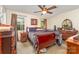 Comfortable bedroom with natural light, wood furnishings, and ceiling fan at 2718 Ridgewood Ln, Rock Hill, SC 29730
