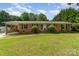 Charming brick ranch home featuring a covered carport and a well-maintained lawn at 2718 Ridgewood Ln, Rock Hill, SC 29730