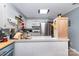 Bright kitchen showcasing white cabinets, tiled countertops, and modern appliances at 2718 Ridgewood Ln, Rock Hill, SC 29730