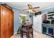 Cozy kitchen featuring blue walls, a breakfast table, and ample storage cabinets at 2718 Ridgewood Ln, Rock Hill, SC 29730
