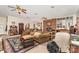 Spacious living room with brick accent wall, ceiling fans, and comfortable seating at 2718 Ridgewood Ln, Rock Hill, SC 29730