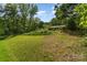 Expansive front yard with mature trees and lush greenery, offering plenty of space for outdoor enjoyment at 2718 Ridgewood Ln, Rock Hill, SC 29730
