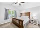 This bedroom is bright and features a ceiling fan and lots of natural light from the large double window at 3006 Emerald Meadow Ln, Charlotte, NC 28273