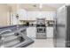 Well-equipped kitchen features stainless steel appliances, white cabinets and a convenient double sink at 3006 Emerald Meadow Ln, Charlotte, NC 28273
