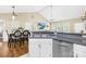 Bright eat-in kitchen and breakfast area features vaulted ceilings and hardwood flooring at 3006 Emerald Meadow Ln, Charlotte, NC 28273