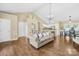 Open-concept living room flows into dining area and kitchen, featuring hardwood floors at 3006 Emerald Meadow Ln, Charlotte, NC 28273