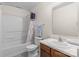 Bathroom featuring a tub shower, toilet, vanity, and framed mirror at 312 Farm Springs Dr, Mount Holly, NC 28120