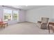 Bright bedroom with neutral carpet, large windows, and ample natural light at 312 Farm Springs Dr, Mount Holly, NC 28120