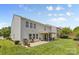 Spacious home with backyard, covered patio and grill, ideal for outdoor living at 312 Farm Springs Dr, Mount Holly, NC 28120