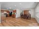 Spacious eat-in kitchen with wood cabinets, appliances, and a dining area at 312 Farm Springs Dr, Mount Holly, NC 28120