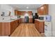Traditional kitchen with wooden cabinets, countertops and black appliances at 312 Farm Springs Dr, Mount Holly, NC 28120