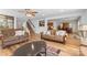 Open floor plan with living room, hardwood floors, staircase, and open view to dining and kitchen at 312 Farm Springs Dr, Mount Holly, NC 28120