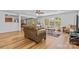 Spacious living room with natural light, hardwood flooring, ceiling fan and comfortable furnishings at 312 Farm Springs Dr, Mount Holly, NC 28120