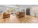 Cozy living area with lots of natural light, complete with hardwood floors and neutral color palette at 312 Farm Springs Dr, Mount Holly, NC 28120