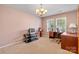 Office with carpet flooring, a chandelier, a window, and a desk at 312 Farm Springs Dr, Mount Holly, NC 28120