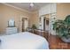Charming bedroom featuring wood floors, a vintage dresser, and plentiful natural light from nearby windows at 321 W Bank St, Salisbury, NC 28144