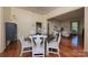 Open dining area featuring hardwood floors and easy access to living room at 321 W Bank St, Salisbury, NC 28144
