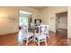 Dining room with hardwood floors, round table, and seating for six at 321 W Bank St, Salisbury, NC 28144