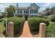 Charming two-story home featuring a brick pathway and manicured hedges at 321 W Bank St, Salisbury, NC 28144