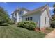 Exterior view of a home showcasing architectural details and landscaping in a lush, green setting at 321 W Bank St, Salisbury, NC 28144
