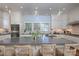 Bright kitchen with white cabinets, gray countertops, an island with seating, and pendant lighting at 321 W Bank St, Salisbury, NC 28144