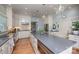 Open kitchen boasts stainless appliances, large gray island, and hardwood floors at 321 W Bank St, Salisbury, NC 28144