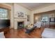 Bright living room with fireplace, hardwood floors, and access to dining area at 321 W Bank St, Salisbury, NC 28144