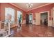 Bright office with a large window, hardwood floors, and modern desk at 321 W Bank St, Salisbury, NC 28144