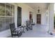 Inviting front porch with rocking chairs, side table, and lovely decor at 321 W Bank St, Salisbury, NC 28144