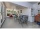 Bright sunroom with comfortable seating, ceiling fans, and screened windows for year-round enjoyment of the outdoors at 321 W Bank St, Salisbury, NC 28144