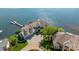 Stunning aerial view of a waterfront home with circular driveway, two-car garage and private dock at 3386 Governors Island Dr, Denver, NC 28037