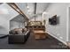Basement features a bar, exposed wood beams, and a spacious seating area, perfect for entertaining at 3386 Governors Island Dr, Denver, NC 28037