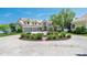 Elegant home showcasing a circular driveway, well-manicured landscaping, and a three-car garage at 3386 Governors Island Dr, Denver, NC 28037
