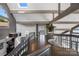 Grand foyer with soaring ceilings, wood beams, and lake views beyond the entrance at 3386 Governors Island Dr, Denver, NC 28037