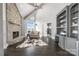 Inviting living room with a stone fireplace, and an adjacent doorway with lake views at 3386 Governors Island Dr, Denver, NC 28037