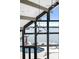 Living room with floor to ceiling windows overlooking the water, stone fireplace and modern decor at 3386 Governors Island Dr, Denver, NC 28037