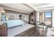 Spacious main bedroom with hardwood floors, lake views, and fireplace at 3386 Governors Island Dr, Denver, NC 28037