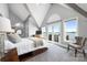 Bright main bedroom features water views, vaulted ceiling with exposed beams, and a cozy sitting area at 3386 Governors Island Dr, Denver, NC 28037