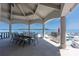Outdoor covered dining area boasts ample seating and lake views, perfect for enjoying meals al fresco at 3386 Governors Island Dr, Denver, NC 28037