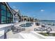 Relaxing outdoor pool with patio furniture, covered grill, and a beautiful view of the lake at 3386 Governors Island Dr, Denver, NC 28037