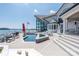Expansive pool area with an in-ground pool, lake view, and outdoor seating perfect for relaxing at 3386 Governors Island Dr, Denver, NC 28037